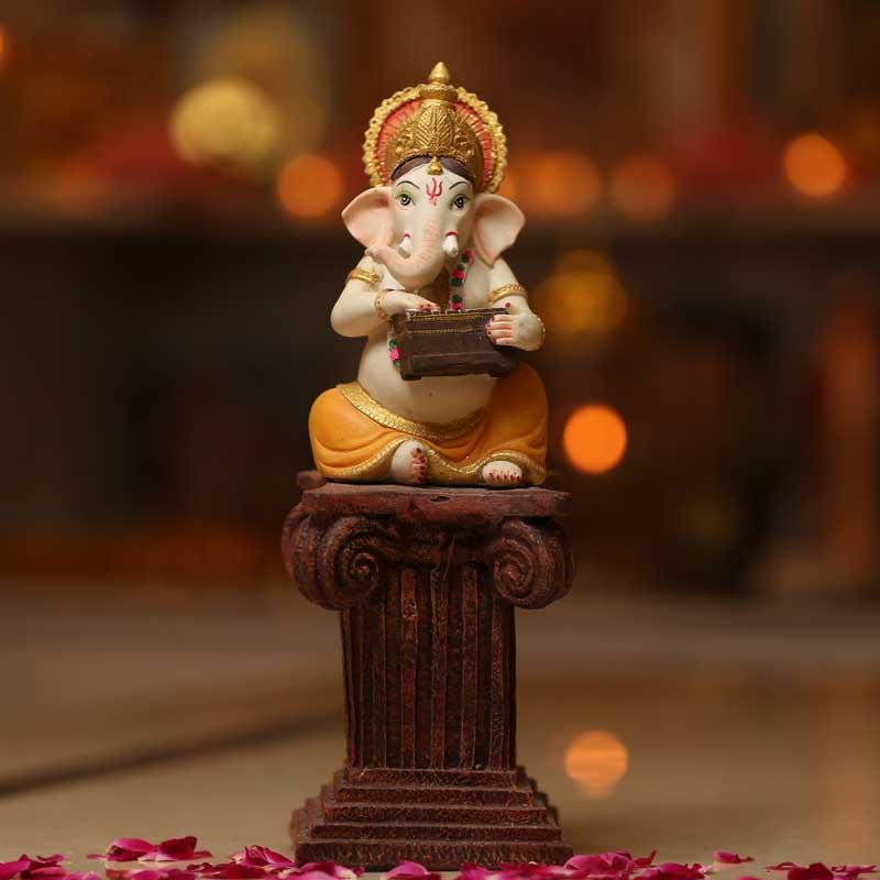 Divine Ganesh Murti on a Pillar