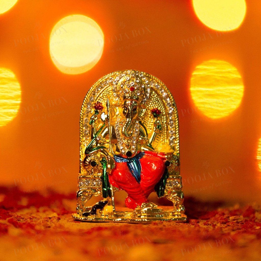 Diamond Studded Ganesh Murti Sitting On Throne Idols